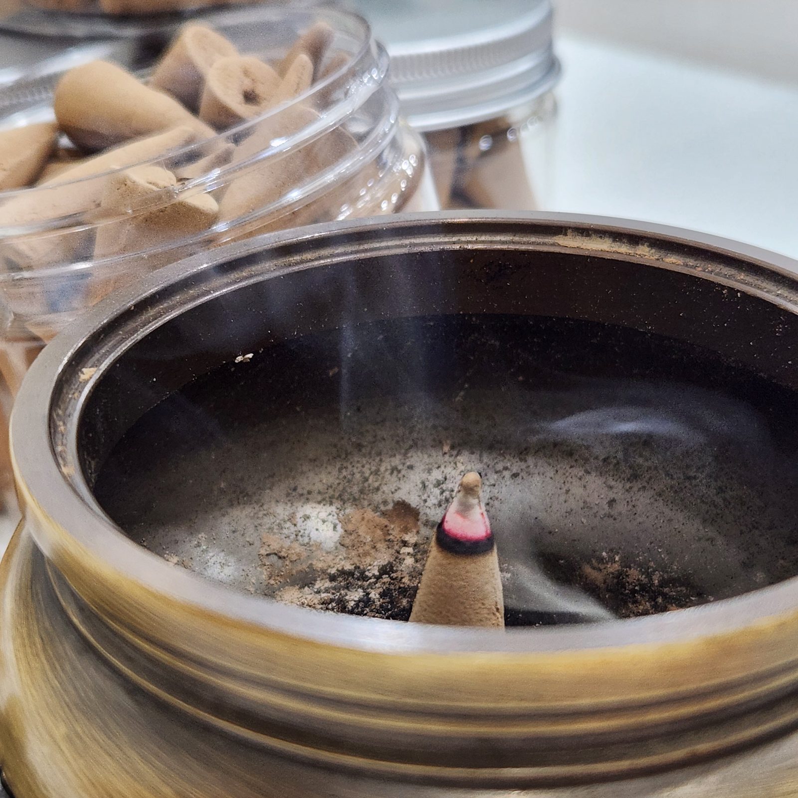 Golden Lotus incense cone burning