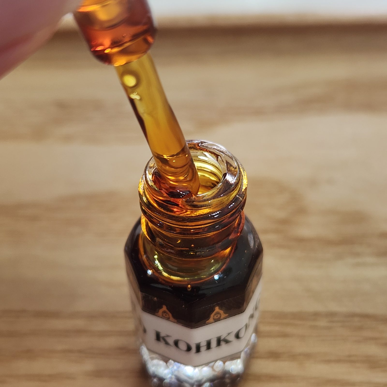 Bright amber-red Kohkong agarwood oil