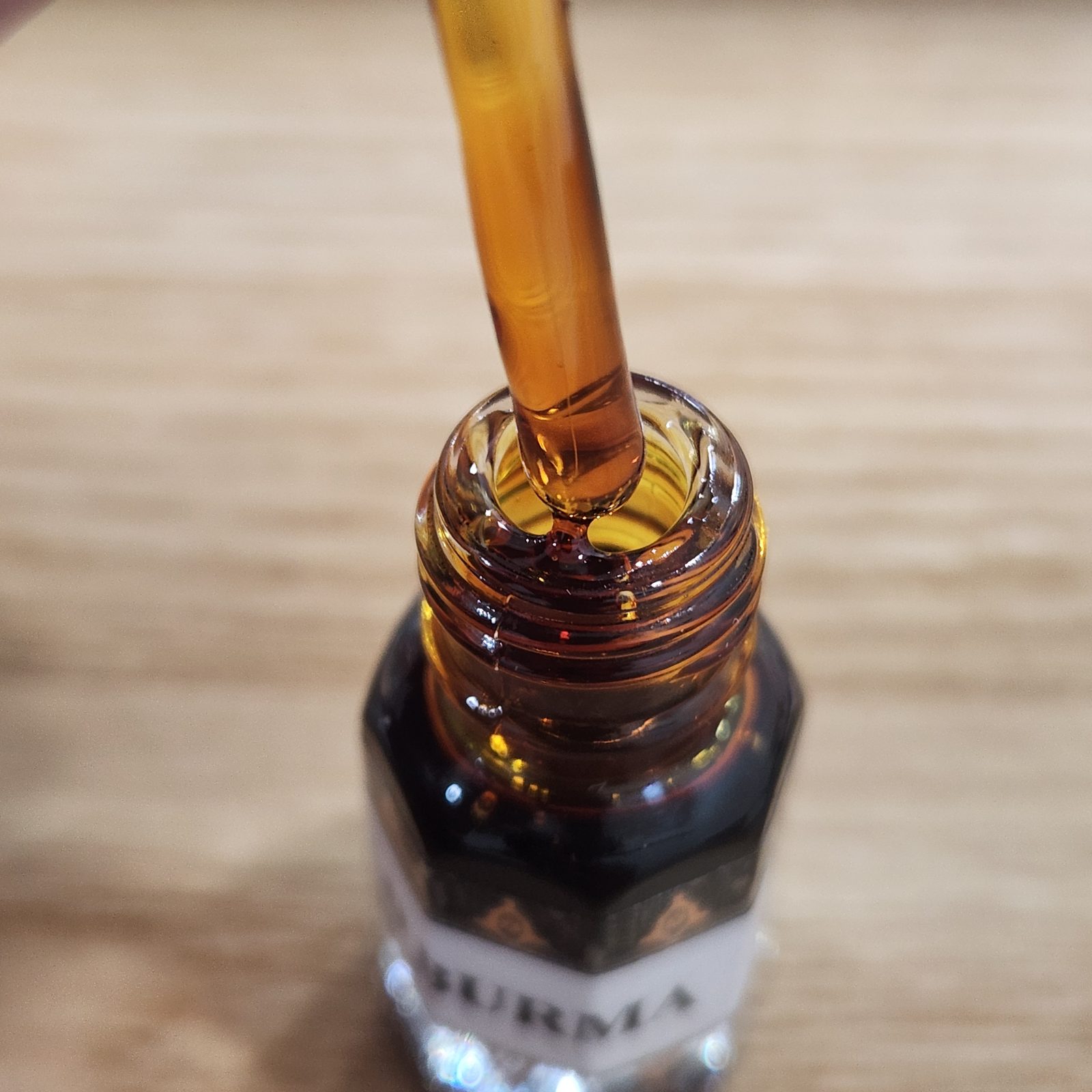 Deep reddish-brown Burma agarwood oil