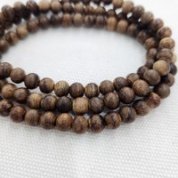 Vòng tay trầm hương 108 hạt 6 mm – trầm hương Việt Nam dạng “banh” từ Tiên Lãnh và Tiên Ngọc, thanh gọn và phù hợp với cổ tay nữ photo 3